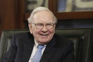 Berkshire Hathaway Chairman and CEO Warren Buffett laughs during an interview with Liz Claman on the Fox Business Network in Omaha, Neb., Monday, May 5, 2014. The annual Berkshire Hathaway shareholders meeting concluded over the weekend. (AP Photo/Nati Harnik)