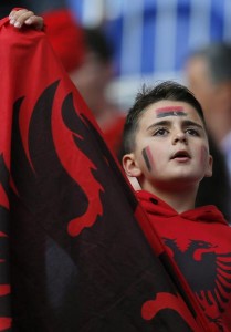 epa05377807 Supporter of Albania cheers prior to the UEFA EURO 2016 group A preliminary round match between Romania and Albania at Stade de Lyon in Lyon, France, 19 June 2016. (RESTRICTIONS APPLY: For editorial news reporting purposes only. Not used for commercial or marketing purposes without prior written approval of UEFA. Images must appear as still images and must not emulate match action video footage. Photographs published in online publications (whether via the Internet or otherwise) shall have an interval of at least 20 seconds between the posting.) EPA/ROBERT GHEMENT EDITORIAL USE ONLY