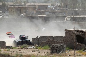 Vehicles of the Iraqi security forces are seen on the outskirts of Falluja