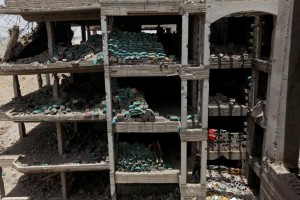 Members of the Iraqi security forces gather in a building on the outskirts of Falluja