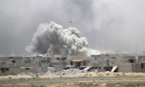 Smoke rises from clashes with Islamic State militants in Falluja