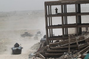 Vehicles of the Iraqi security forces are seen on the outskirts of Falluja