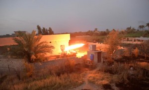 Shi'ite fighters forces launch a rocket towards Islamic State militants on the outskirts Falluja