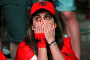 Albanias supporters react as they watch the Euro 2016 football match between France and Albania at the fan zone on Tiranas main boulevard on June 15, 2016. / AFP PHOTO / STRINGERSTRINGER/AFP/Getty Images