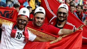 epa05377810 Supporters of Albania cheer prior to the UEFA EURO 2016 group A preliminary round match between Romania and Albania at Stade de Lyon in Lyon, France, 19 June 2016. (RESTRICTIONS APPLY: For editorial news reporting purposes only. Not used for commercial or marketing purposes without prior written approval of UEFA. Images must appear as still images and must not emulate match action video footage. Photographs published in online publications (whether via the Internet or otherwise) shall have an interval of at least 20 seconds between the posting.) EPA/ROBERT GHEMENT EDITORIAL USE ONLY