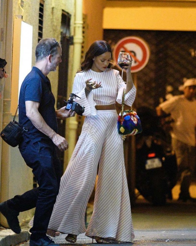 *EXCLUSIVE* Antibes, France - Rihanna barely escapes the Bastille Day Terror Attacks while on tour in France. The 28 year old singer was staying at the Hyatt Regency Nice Palais de la Méditerranée when she decided to go to dinner at the Michelangelo Restaurant in nearby Antibes. While out to dinner the Bastille Day terror attacks occurred on the Promenade des Anglais, the route which the singer took to go to Antibes. Rihanna is seen stepping outside to drink a glass of wine to calm down while she makes a series of phone calls and finds a new place to sleep for the night. Rihanna was due to perform at the Allianz Stadium on Friday but for security reasons she has cancelled her concert in Nice. AKM-GSI July 14, 2016 To License These Photos, Please Contact : Maria Buda (917) 242-1505 mbuda@akmgsi.com sales@akmgsi.com Mark Satter (317) 691-9592 msatter@akmgsi.com sales@akmgsi.com www.akmgsi.com