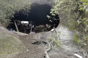 In this July 28, 2016 photo, Pedro Mamani prepares food inside a mountain cavern near San Pedro de Colalao, Argentina's northern province of Tucuman. Luca has lived in a cave in northern Argentina for 40 years. The 79-year-old man has survived without running water and electricity in his cavern high up in a mountain in northern Tucuman province. (AP Photo/Alvaro Medina)