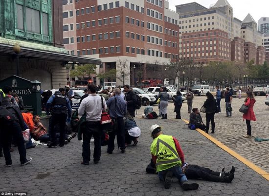 38EBB91200000578-3813781-Passengers_are_seen_being_treated_on_the_side_of_the_road_outsid-a-63_1475157481444