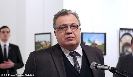 Andrei Karlov, the Russian Ambassador to Turkey, pauses during a speech at a photo exhibition in Ankara on Monday, Dec. 19, 2016, moments before a gunman opened fire on him. Karlov was rushed to a hospital after the attack and later died from his gunshot wounds. (AP Photo/Burhan Ozbilici)