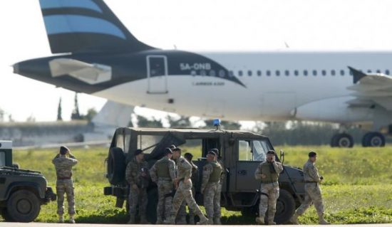 Maltese troops survey a hijacked Libyan Afriqiyah Airways Airbus A320 on the runway at Malta Airport, December 23, 2016. REUTERS/Darrin Zamit-Lupi