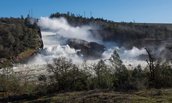 The California Department of Water Resources continues to discharge 55,000 cubic feet per second (cfs) of water from the Lake Oroville damaged spillway on Sunday morning. DWR is closely monitoring any upward erosion from the spillway site in Butte County. Photo taken February 12, 2017. Kelly M. Grow/ California Department of Water Resources