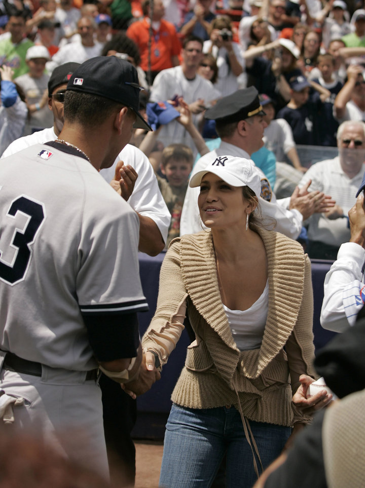 Actress Jennifer Lopez shakes hans with Alex Rodriguez before a subway series game between the New York Mets and the New York Yankees at Shea Stadium in Queens, New York on Saturday May 21, 2005. The Mets beat the Yankees 7-1. (Photo by Mike Ehrmann/WireImage)